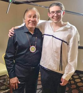 Lakota game developer Carl Peterson poses with Olympic gold medalist Billy Mills. In March, Petersen was the recipient of a $10,000 grant from Mills’ foundation, which he used to launch his company, Northern Plains Video Design.